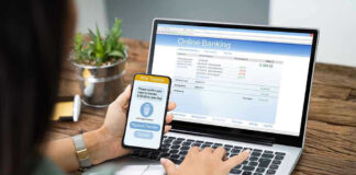 Person using online banking on laptop and smartphone.