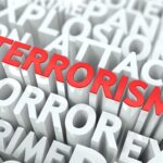The word 'TERRORISM' prominently displayed in red among other related terms