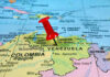 Red pin on Venezuela, South America map.