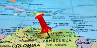 Red pin on Venezuela, South America map.