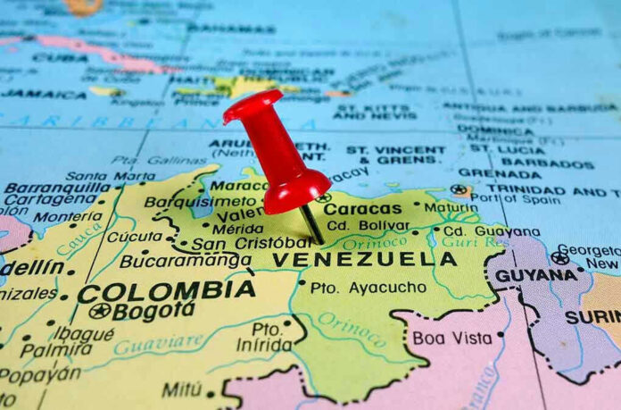 Red pin on Venezuela, South America map.