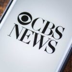 Noem vs. CBS Showdown CBS News logo displayed on a screen