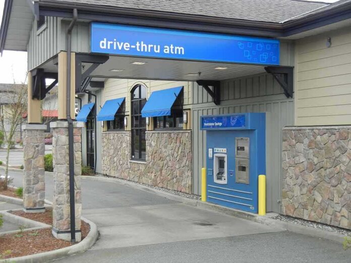 Drive-thru ATM at a bank with blue awnings