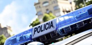 Close-up of a police cars light bar with the word POLICIA