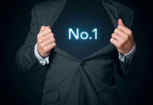 Man opening suit to reveal glowing number one