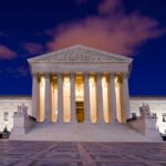 Supreme Court CRUSHES Trump — $200B Chaos The Supreme Court building illuminated at night with a clear sky