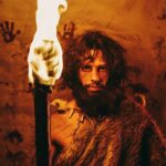 Democrat Star TORCHES Western Civilization — Details Emerge A prehistoric man holding a torch in front of cave paintings