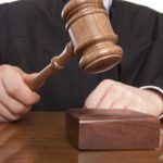 Judge Blocks Shocking Move In Kirk Case A judge holding a gavel above a wooden block