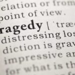 Packed Crowd Mowed Down—Authorities Withhold Identity Close-up of the word 'Tragedy' in a dictionary with its definition