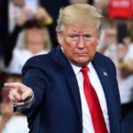 Trump Ceasefire COLLIDES With Iran Seizures A speaker at a rally pointing towards the audience