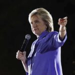 Hillary BUSTED–-Detention SCANDAL REVEALED A woman speaking into a microphone at an outdoor event