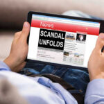Ex-Congressman’s Shocking Venezuela SCANDAL Person reading tablet with headline Scandal Unfolds.