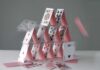 A house of cards collapsing with some cards in motion
