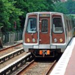 Evacuated Kids Escape Horror Belgium Crash! Metro train arriving at a station surrounded by greenery