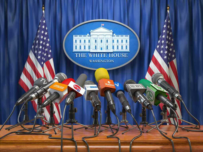 1186435138-2 Multiple microphones at White House press briefing podium.