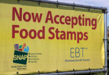 SNAP Fraud Claims Under Scrutiny Yellow sign now accepting food stamps EBT SNAP