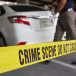Bodycam Bombshell: Teen Begs, Gets Cuffed Crime scene tape blocking off white sedan.