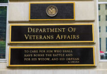 Marine Hero’s Medal of Honor Block Finally Lifted Department of Veterans Affairs building sign with quote.