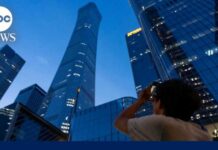 Plane slams into Beijing's tallest building, sends debris raining down onto streets