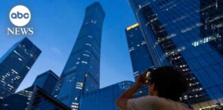 Plane slams into Beijing's tallest building, sends debris raining down onto streets