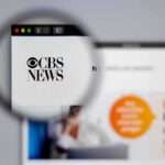CBS Firestorm: 60 Minutes Star Cries Foul Magnifying glass focusing on CBS News logo on a website