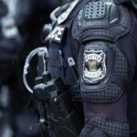 Arrest Threat Over Bible Pamphlets—“You’re Going to Jail.” Close-up of a police officer's uniform with a Seattle Police patch