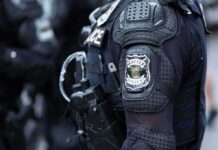 Arrest Threat Over Bible Pamphlets—“You’re Going to Jail.” Close-up of a police officer's uniform with a Seattle Police patch