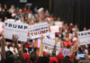 Minnesota Governor’s Race Heats Up Crowd holding signs supporting Trump at a rally.