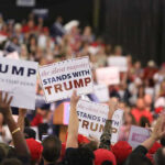 Minnesota Governor’s Race Heats Up Crowd holding signs supporting Trump at a rally.