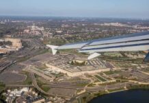 Five Dead, Two Children Orphaned After Ohio River Rescue Attempt airplane wing over a sprawling government complex