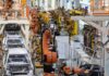 Michigan Victory Lap Faces Pushback From Courts, Businesses, and State Leaders Industrial robots assemble car bodies on an automotive production line