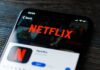 Close-up of a smartphone displaying the Netflix app interface