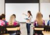 A teacher presenting to students in a classroom