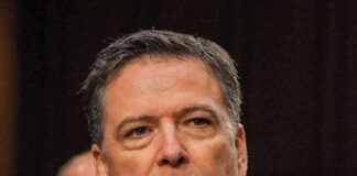 man in suit at a hearing
