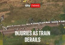 UK Train Chaos — Cars Tip Over Two people seriously injured as aerial footage shows scale of train derailment