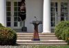 Podium with presidential seal in a garden colonnade