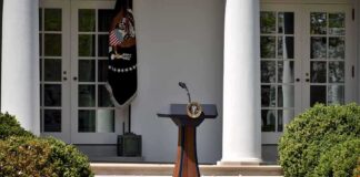 Podium with presidential seal in a garden colonnade