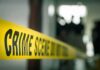 Wearable Data Could Help Solve Missing Man Case crime scene tape in a blurred indoor setting