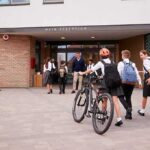 New Jersey School Policy Sparks Fight Over Religious Freedom Students in uniforms arriving at a school entrance