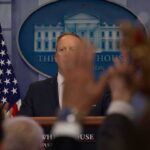 Nuclear First-Use Warning Sparks Debate Press secretary at podium with raised hands in briefing room