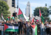 Commentator Challenges Democrats Over Gaza and Radical Islam Protesters holding signs and flags in a public square.