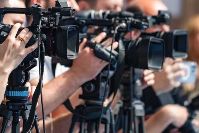 Camera,Recording,At,A,Media,Press,Conference,Preserves,Accurate,Details television cameras on tripods at a media event