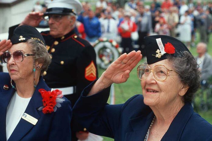 Circa,1998,-,World,War,Ii,Women,Veterans,Saluting,At Elderly women in military attire saluting during a veterans ceremony