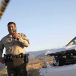 Policy Gap Kills Trooper Police officer at crash scene near damaged white car