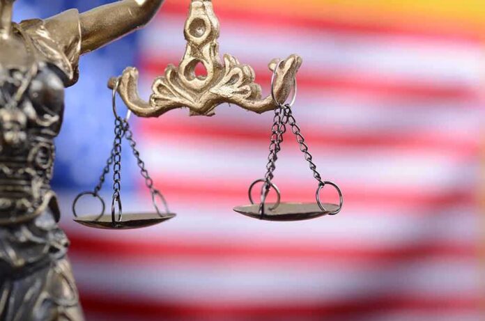 Lady Justice scales with American flag background