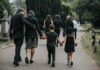 Family Raises UVU Security Concerns Mourners walking together through a cemetery path