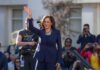 Harris Still Undecided on 2028 woman in navy suit waving at an outdoor event