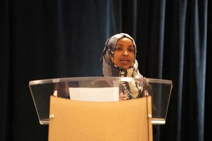 Woman in hijab speaking at a podium