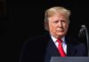 Fact-Check Faces Questions Over Its Numbers Donald Trump at a podium with a microphone