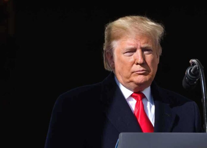 shutterstock_1551196562 Donald Trump at a podium with a microphone